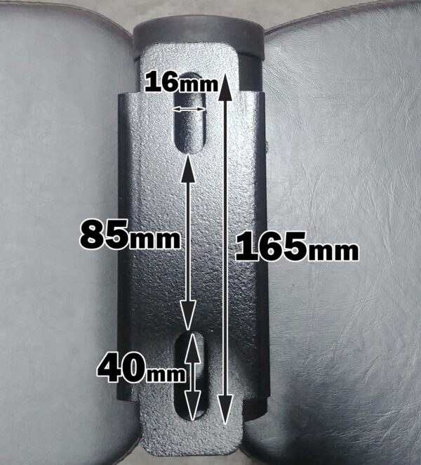 The ATX® Barbell Storage, a metal bracket with a vertical design, features dimensions of 165mm in height, 85mm inner width, and top and bottom openings of 16mm and 40mm wide respectively. It is displayed against a dark surface.