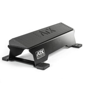 The ATX® Calf Block is a black, steel workout step featuring a non-slip surface and side logo, ideal for fitness exercises. This sturdy rectangular platform doubles as a calf block with a strong base and protective corner caps.
