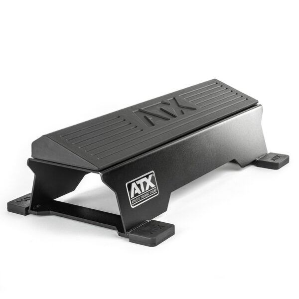 The ATX® Calf Block is a black, steel workout step featuring a non-slip surface and side logo, ideal for fitness exercises. This sturdy rectangular platform doubles as a calf block with a strong base and protective corner caps.