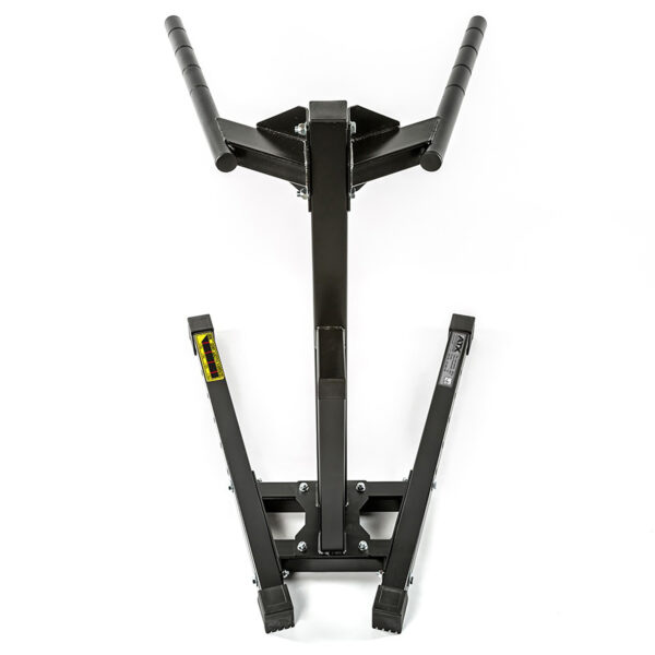 Introducing the ATX® Dip Station, a black weightlifting trap bar featuring a hexagonal frame with raised handles on each side, reminiscent of those found on a dip workout machine. Positioned upright against a white background, it highlights its design to offer an optimal grip during exercises.