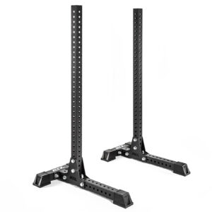 The ATX® Portable Squat Stands SET features two black metal stands with adjustable height, multiple adjustment holes, and a sturdy base with diagonal supports. The design is portable with brand markings and set against a plain white background.