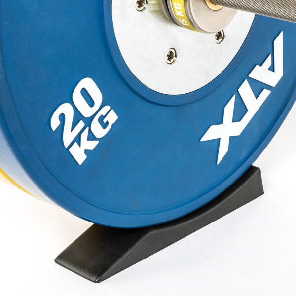 Close-up of a barbell with a blue 20 kg ATX weight plate resting securely on an ATX® Deadlift Wedge.