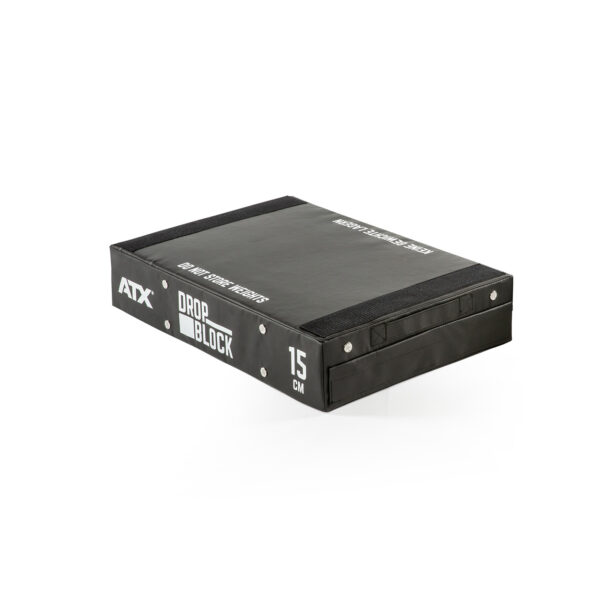 The ATX® 15 cm Soft Drop Block is black, measures 15 cm high, and is designed for weightlifting. It features ATX DROP BLOCK and 15 CM on the side with a smooth surface and reinforced edges.