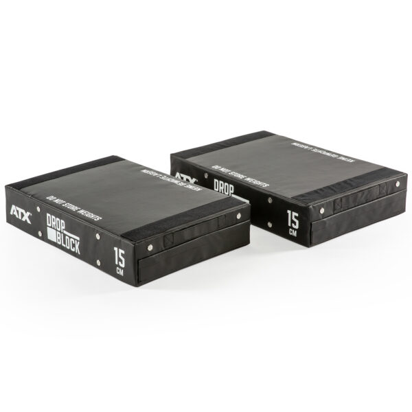 Two ATX® 15 cm Soft Drop Blocks are shown side by side. Theyre rectangular and black with white text reading ATX DROP BLOCK and MAX WEIGHT 300KG, designed for weightlifting or fitness use.