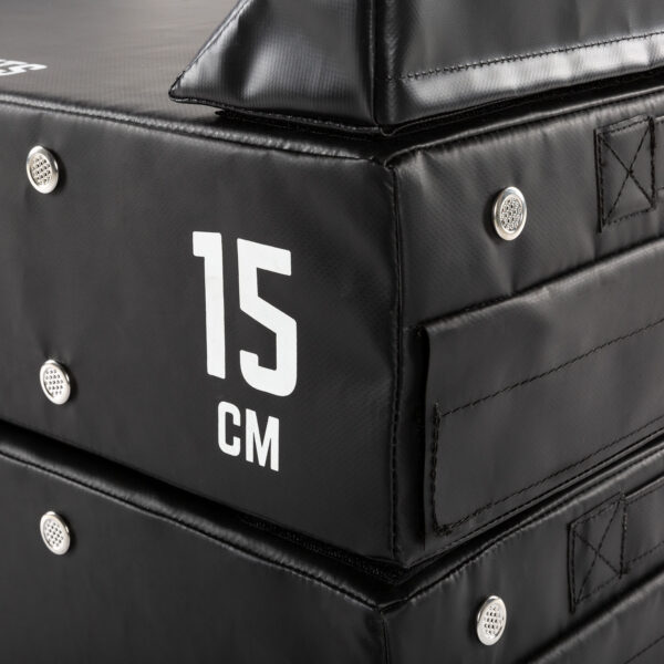 Close-up of ATX® 15 cm Soft Drop Blocks stacked, featuring a white 15 cm label for thickness, reinforced corners, and metal rivets for durability.
