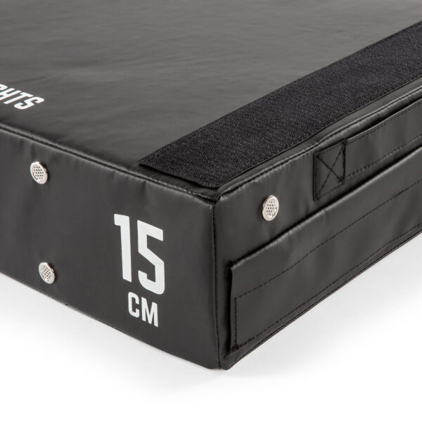 Close-up of an ATX® 15 cm Soft Drop Block in black, displaying a corner with reinforced stitching and a 15 CM white print. The durable, textured surface features metal grommets and Velcro edging.