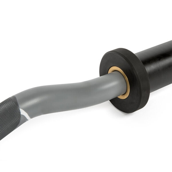 Close-up of a gray, spiraled cable attached to a black circular component with a gold ring; its textured grip resembles the ATX® EZ Bar Curl Camo, suggesting it is part of a larger device.