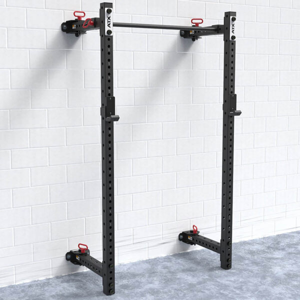 A sturdy, black steel wall-mounted pull-up bar attached to a white tiled wall. Beneath is a blue-grey carpeted floor, and the pull-up bar features multiple holes for adjustments with red hooks for added accessories, seamlessly integrating with your existing wall mount squat rack setup.