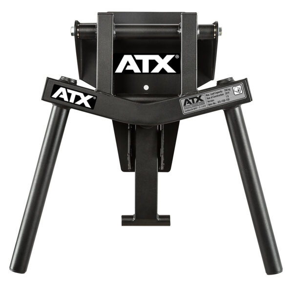 The ATX® Folding Wall Mounted Dip Handles have a black, sturdy metal frame with two angled legs and folding arms. They are designed for use with exercise equipment and feature a logo on top and a specifications label.