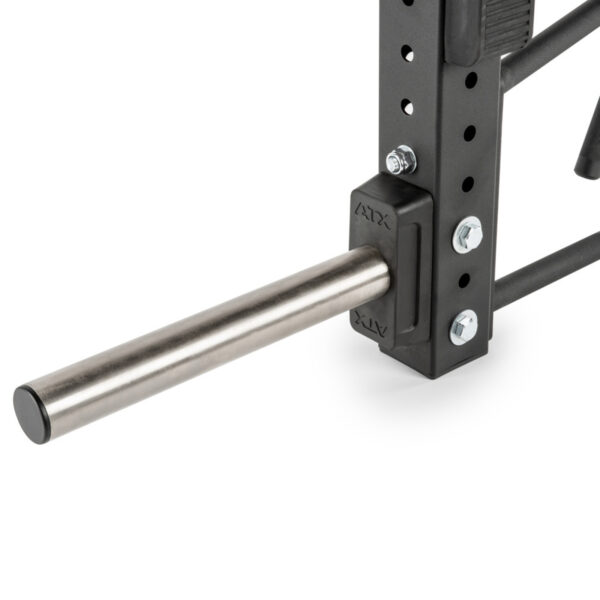 A close-up shows an ATX® Jammer Arms attachment, with a long metal bar extending horizontally and secured by bolts on a black, perforated frame with branding. The setup appears sturdy and industrial.