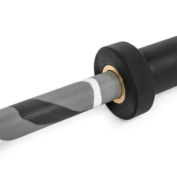 Close-up of the ATX® Olympic 150cm Barbell Camo, showcasing its textured grip with a gray and white pattern, and a black weight plate secured by a gold-colored ring on a white background.