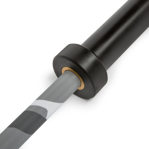 A close-up of the ATX® Olympic Camo Power Bar shows a black barbell sleeve with a gray camo lifting strap wrapped around its smooth, cylindrical end.