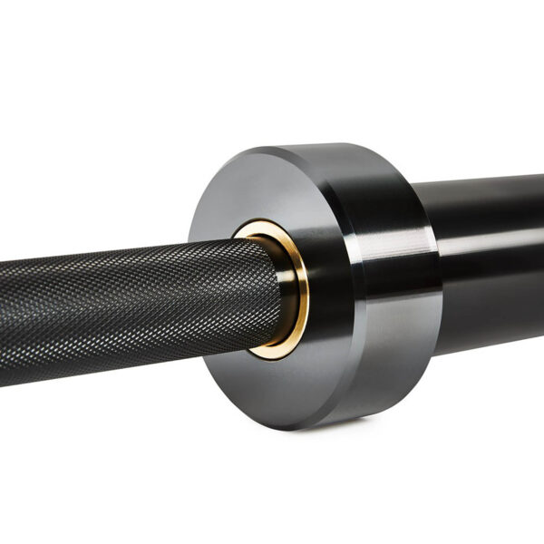 Close-up of an ATX® Olympic Black Mamba Power Bar with a textured grip and gold accents. The barbells end showcases a smooth, rounded weight collar, highlighting the sleek and modern design of this fitness equipment.