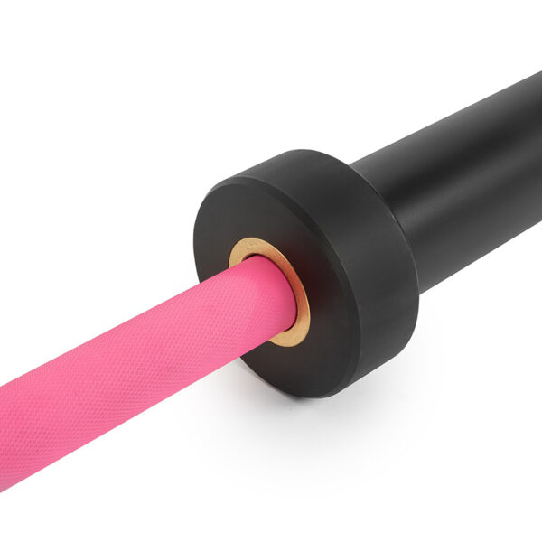The ATX® Womens PINK 15kg Bar features a close-up of a pink grip with a textured surface, designed for better hold during workouts, and a sleek black collar.