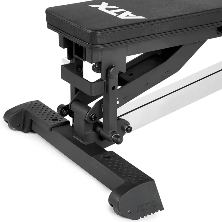 Close-up of a black ATX® Multi Bench with a metal frame, stabilized base, and adjustable hinges on the seat for varying incline levels.