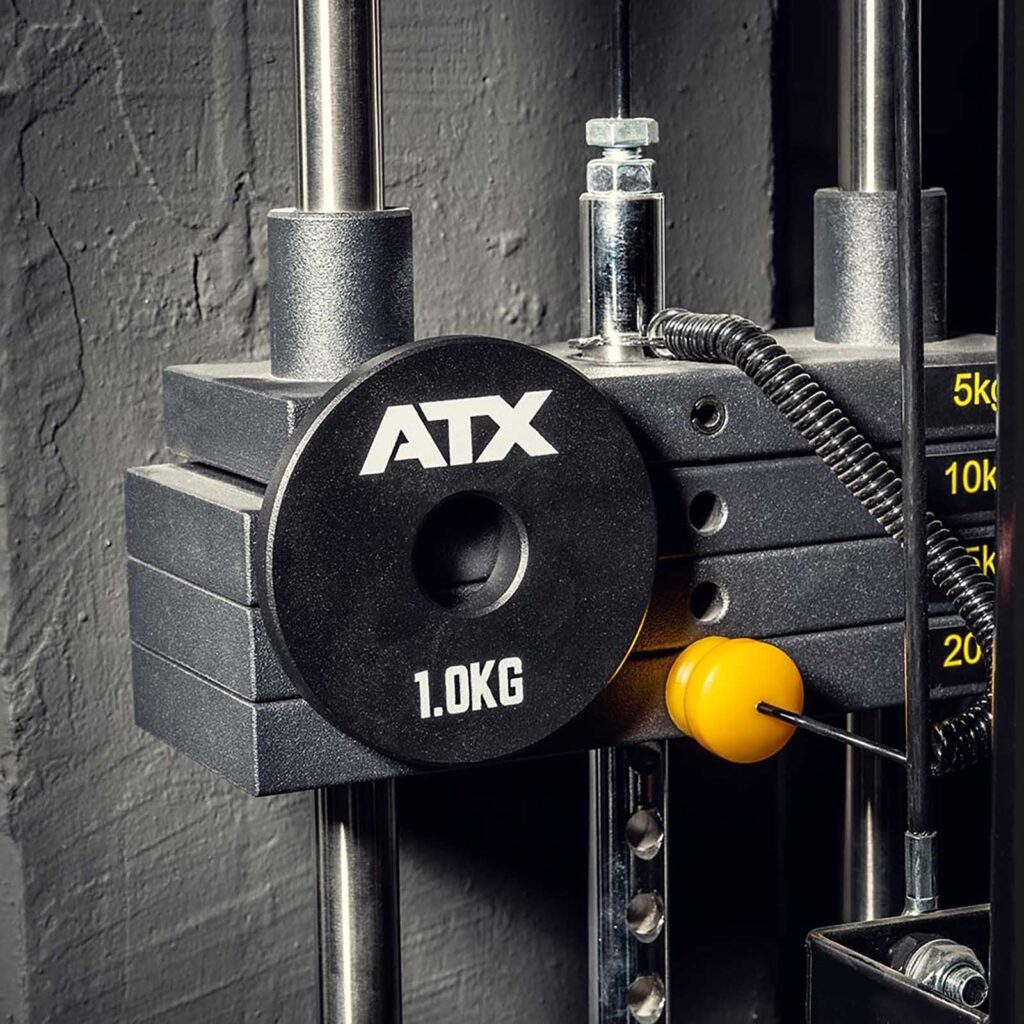 ATX Magnetic Weight Plates stuck to a weight stack. 