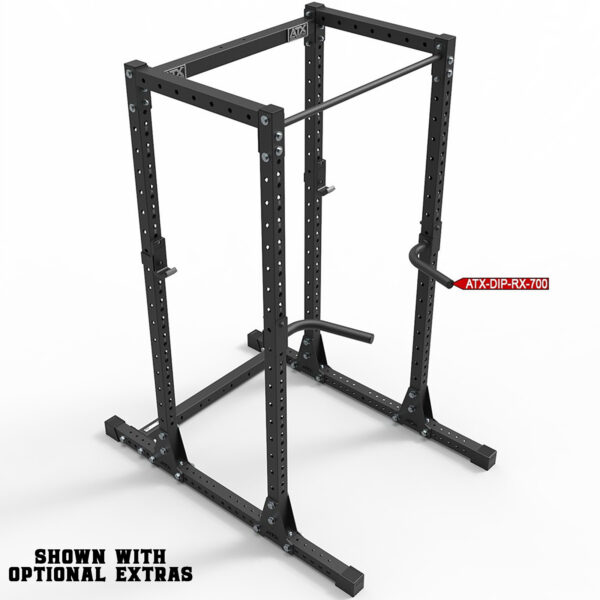 The ATX® Commercial Power Rack 750 is a black power rack with adjustable parts and a dip bar attachment, ideal for weightlifting. The frame is robust, and text on the bottom left notes: Shown with optional extras.