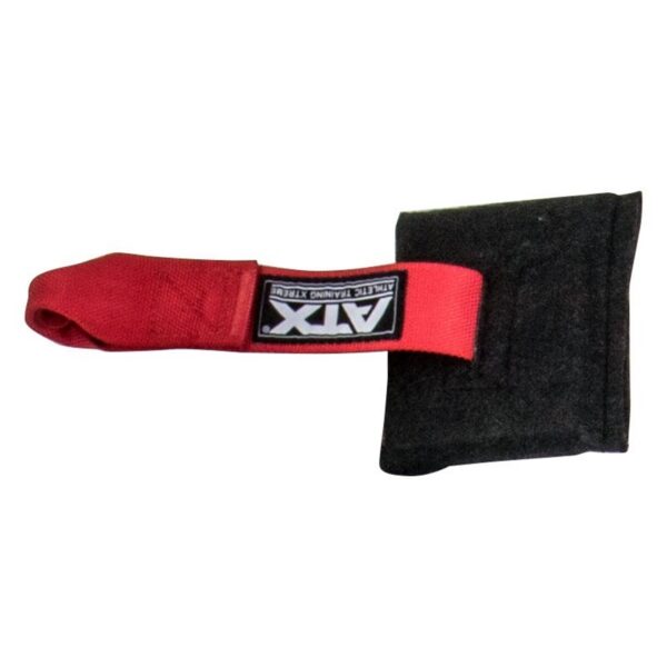 The ATX® Suspension Trainer Set PRO is a black and red martial arts training tool featuring a padded black striking surface and a versatile suspension trainer system with a red AX labeled strap.