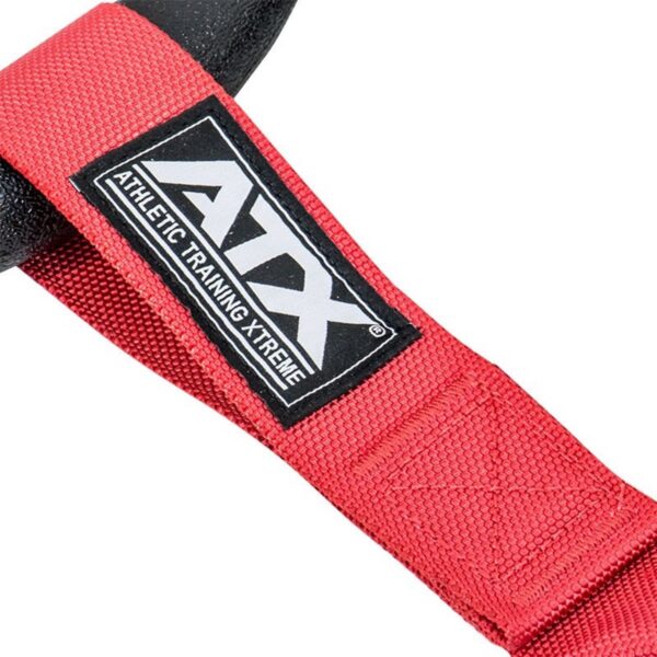 Close-up of a red suspension trainer strap from the ATX® Suspension Trainer Set PRO, featuring a black and white ATX Athletic Training Xtreme logo. The durable fabric texture is prominently visible.