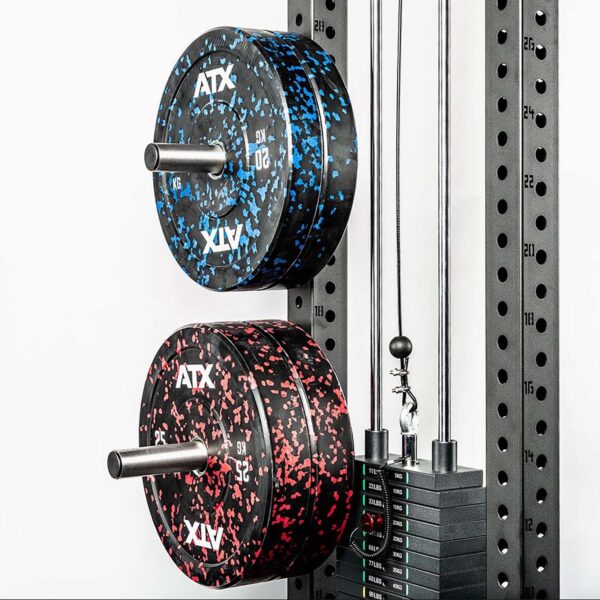 A close-up of a gym rack featuring two ATX® Weight Plate Pins, with one blue-speckled and one red-speckled plate attached. The rack includes a cable system with stacked weights, set against a plain white background.