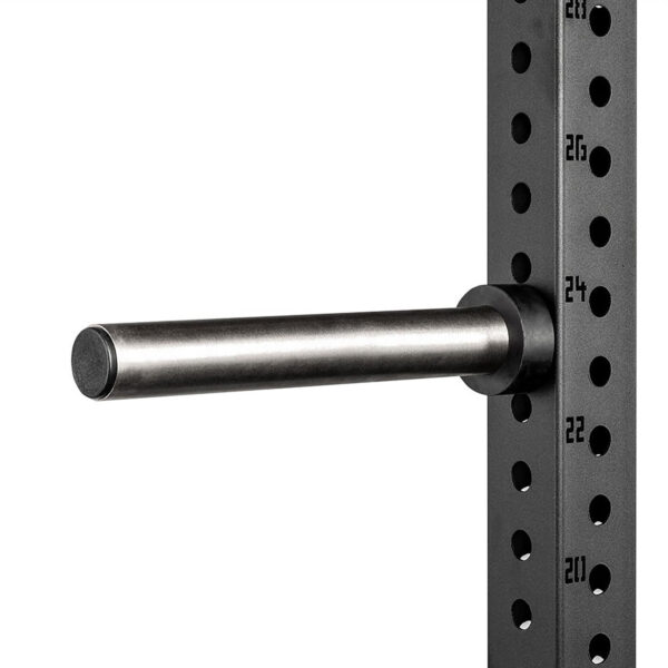 Close-up of the ATX® Weight Plate Pin extension arm. The metal arm extends horizontally from a vertical perforated support beam with numbered holes for adjustable height settings. The beam is dark, and the numbers are marked in white.