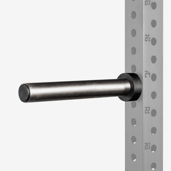 A metal rod fixed to the side of a perforated metal rack, likely an ATX® Weight Plate Pin. The rack has numbered markings on the side for adjusting different height levels.
