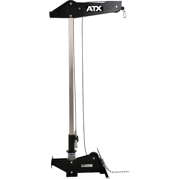 The ATX® Wall Mounted Lat Pulldown, sporting a sleek black and silver design with the ATX brand name prominently displayed, is a versatile winch featuring a tall vertical structure and a horizontal arm with a cable-attached hook. Its base includes mounting components and a chain, reminiscent of similar systems.