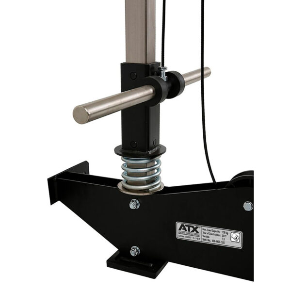 Close-up of the ATX® Wall Mounted Lat Pulldown's adjustable components, showcasing a metal handlebar and spring mechanism. The ATX brand label is clearly visible, highlighting the machine's maximum load capacity of 110 kg (242 lbs).