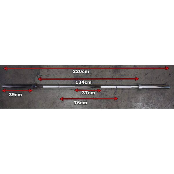 Image of a 7ft 1500lbs Olympic Bushing Bar with marked measurements: total length 220 cm, weightlifting section 134 cm, handle section 39 cm, grip width 37 cm, on concrete flooring.