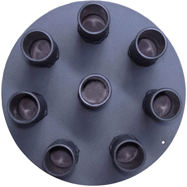 The Power Maxx 8 Barbell Holder is a round gray metal object featuring seven cylindrical protrusions in a circular arrangement, similar to a rocket engine. One cylinder is at the center, with the others evenly spaced around it.
