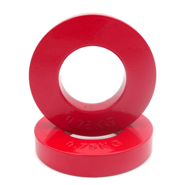 Two red plates from the Power Maxx Olympic 5kg Fractional Plate Set, each weighing 0.75 KG, are displayed: one upright with its hole visible and the other lying flat beneath.
