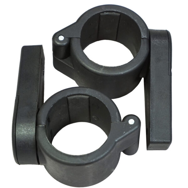 Two Power Maxx Olympic Bar Clamps, black plastic with circular openings, secures pipes or rods. Each clamp has a hinged latch for easy fastening and release. The clamps sit side by side on a white background.