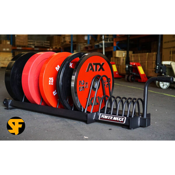 The Bumper Weight Plate Toaster Rack displays weight plates in black, red, and orange, neatly organized with visible branding and measurements, resembling a toaster rack. They stand ready in the warehouse under the Power Rack label.