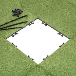 A section of GymFloor® RTS Turf 50x50@20mm is removed to expose a white square base. Nearby, black connectors and rods on the grass indicate upcoming assembly or installation.