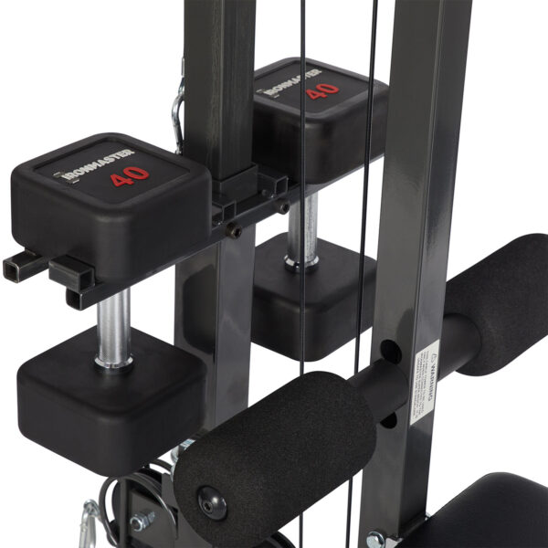 The Ironmaster Cable Tower Attachment V2 features adjustable weights, cushioned handles, and visible weight indicators set at 40. Its black and silver components highlight a durable, compact design ideal for home gyms.