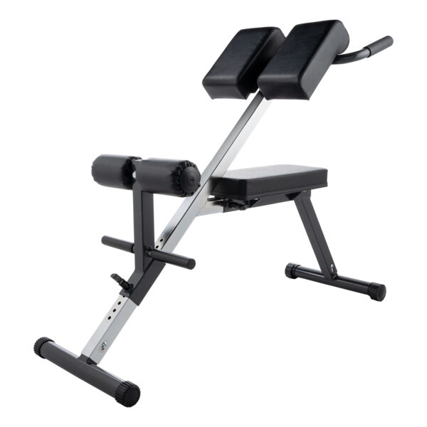 The Ironmaster Cable Tower Seat is black and silver, featuring padded supports for legs and hips. It has adjustable settings for various user heights, an angled frame, and a non-slip base. Designed for back and core exercises with ergonomic use in mind.