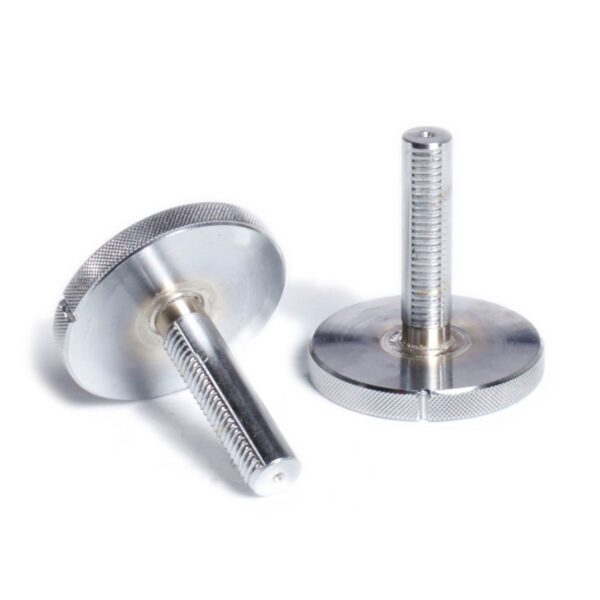 Two Ironmaster Quick Lock Dumbbell Handles are shown. One is upright, revealing the threaded shaft, and the other lies flat, showcasing its circular head. The textured edges stand out against a plain white background.