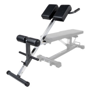 The Ironmaster Hyper Core Attachment is an adjustable exercise bench with black cushioned supports on a metal frame and a foam-padded leg support bar, designed for back workouts. The bench section is partially visible in the background.