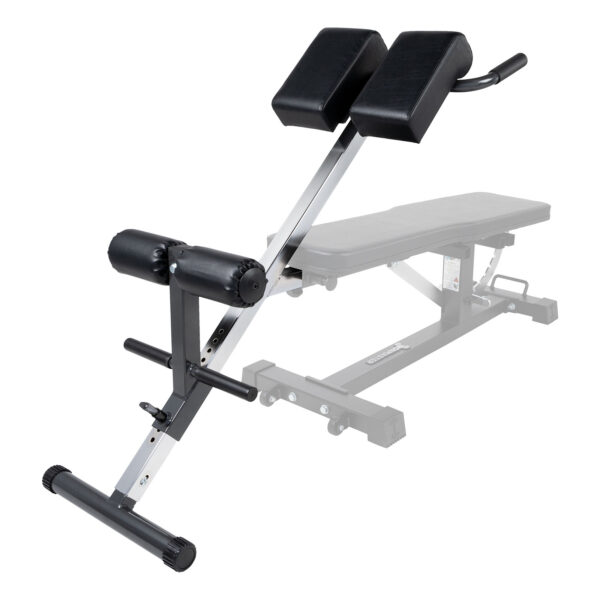 The Ironmaster Hyper Core Attachment is an adjustable exercise bench with black cushioned supports on a metal frame and a foam-padded leg support bar, designed for back workouts. The bench section is partially visible in the background.