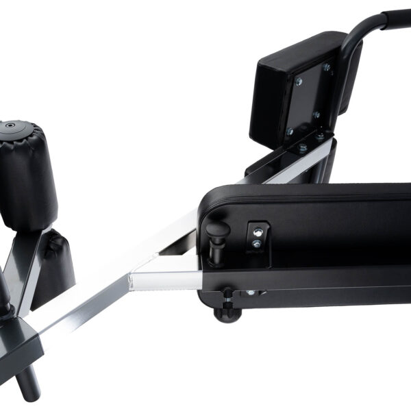 The Ironmaster Hyper Core Attachment, shown in a close-up, is a black padded exercise machine with a sturdy metal frame. It features adjustable components and cushioned areas for comfort, ideal for strength training or flexibility exercises.