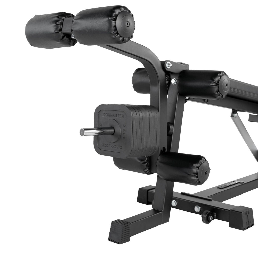 Close-up of the Ironmaster Leg Lift PRO, a black gym leg press machine with padded rollers and weight stack. It boasts a modern design with a sturdy metal frame and adjustable mechanism.