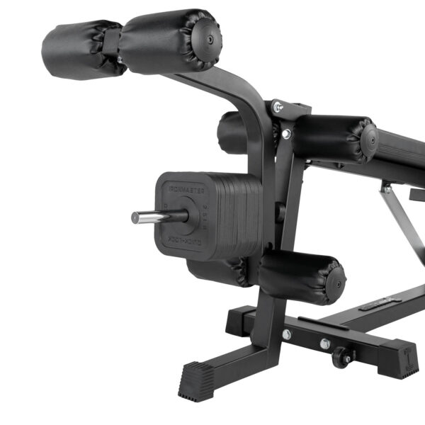 Close-up of the Ironmaster Leg Lift PRO, a black gym leg press machine with padded rollers and weight stack. It boasts a modern design with a sturdy metal frame and adjustable mechanism.