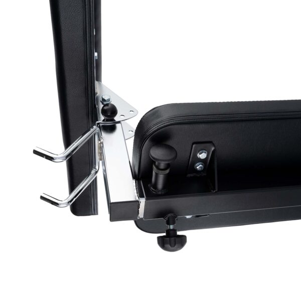 Close-up of the Ironmaster Preacher Pads black adjustable weight bench mechanism, showcasing the metal frame, adjustment knobs, and securing hooks. The design features sleek silver accents and a robust construction.