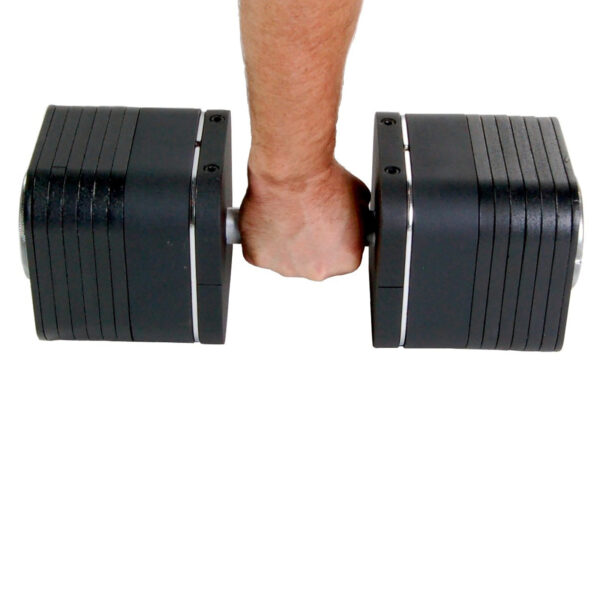 A person holds an Ironmaster Heavy Handle Kit, featuring a large black adjustable dumbbell with several weight plates attached. The white background accentuates the dumbbells impressive size and sleek design.