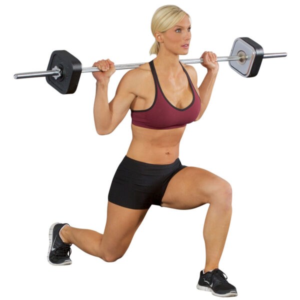 Wearing a maroon sports bra, black shorts, and sneakers, a person lunges while holding an Ironmaster Straight Barbell across their shoulders. They demonstrate strength and fitness in an exercise pose against a white background.