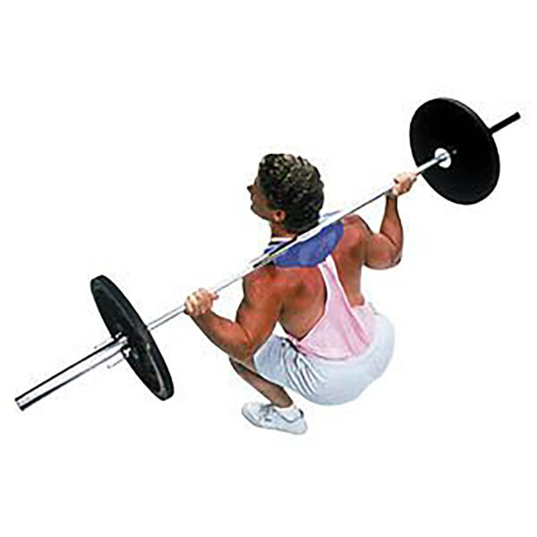 A muscular individual with curly hair performs The Mantaray Squat, displaying strength and precision while gripping the barbell. Clad in a sleeveless pink top and white shorts, the scene is captured from an aerial perspective.