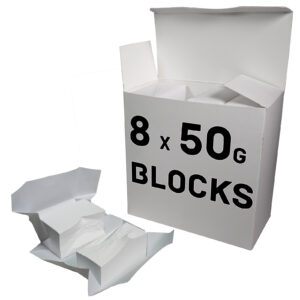 A large white chalk box labeled 8 x 50g Blocks sits with its lid open. Two smaller opened packages reveal white powder blocks perfect for gym chalk use, placed in front of the box.