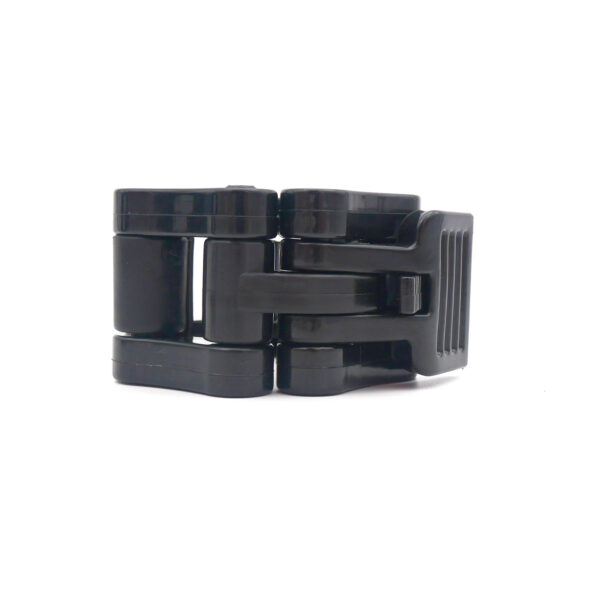 A black folding buckle closure on a white background with interlocking rectangular components and a ribbed side, similar to Olympic Lock Jaw Collars.