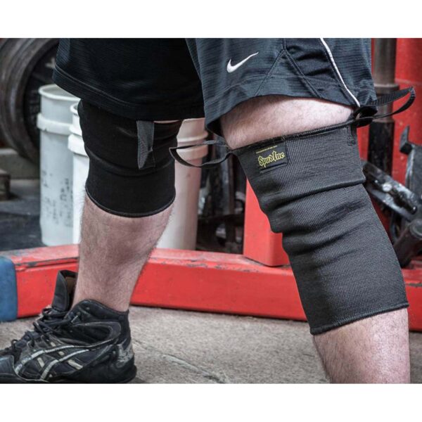 Wearing Spud Knee Sleeves 1 Ply, one appears primed for action, with their durable design offering excellent support and protection.