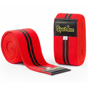 A pair of red knee wraps featuring black stripes and labels, one rolled up and the other partially unrolled. The label displays Spud Inc and 250 CM.